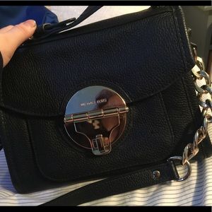 black and gold crossbody Michael Kors bag